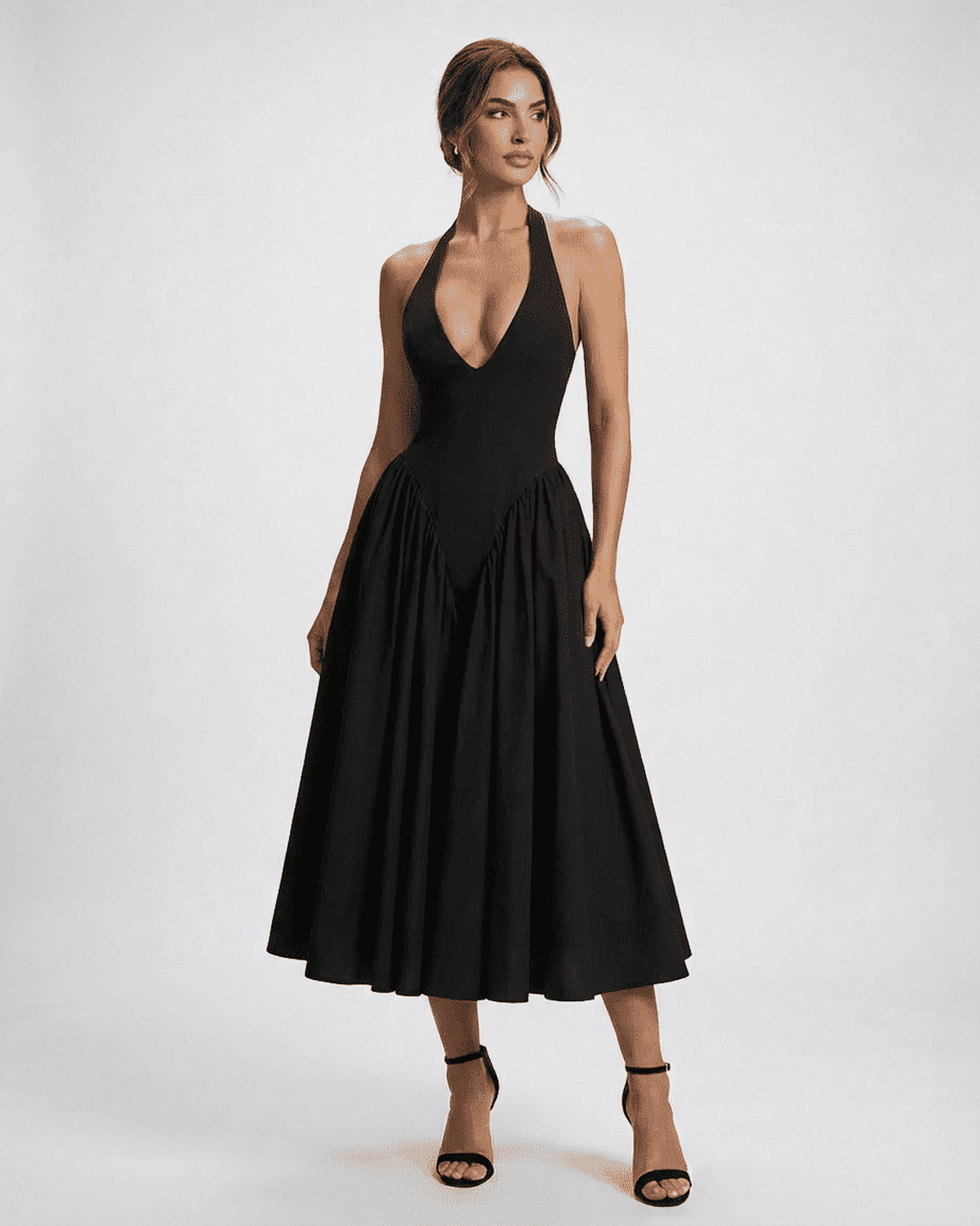 Celeste Midi Dress by Lauven featuring a halter neck and backless design, elegant black A-line silhouette.