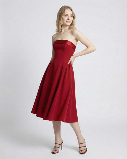 Celeste Midi Dress by Lauven, strapless high-waist midi silhouette in elegant red with pockets.