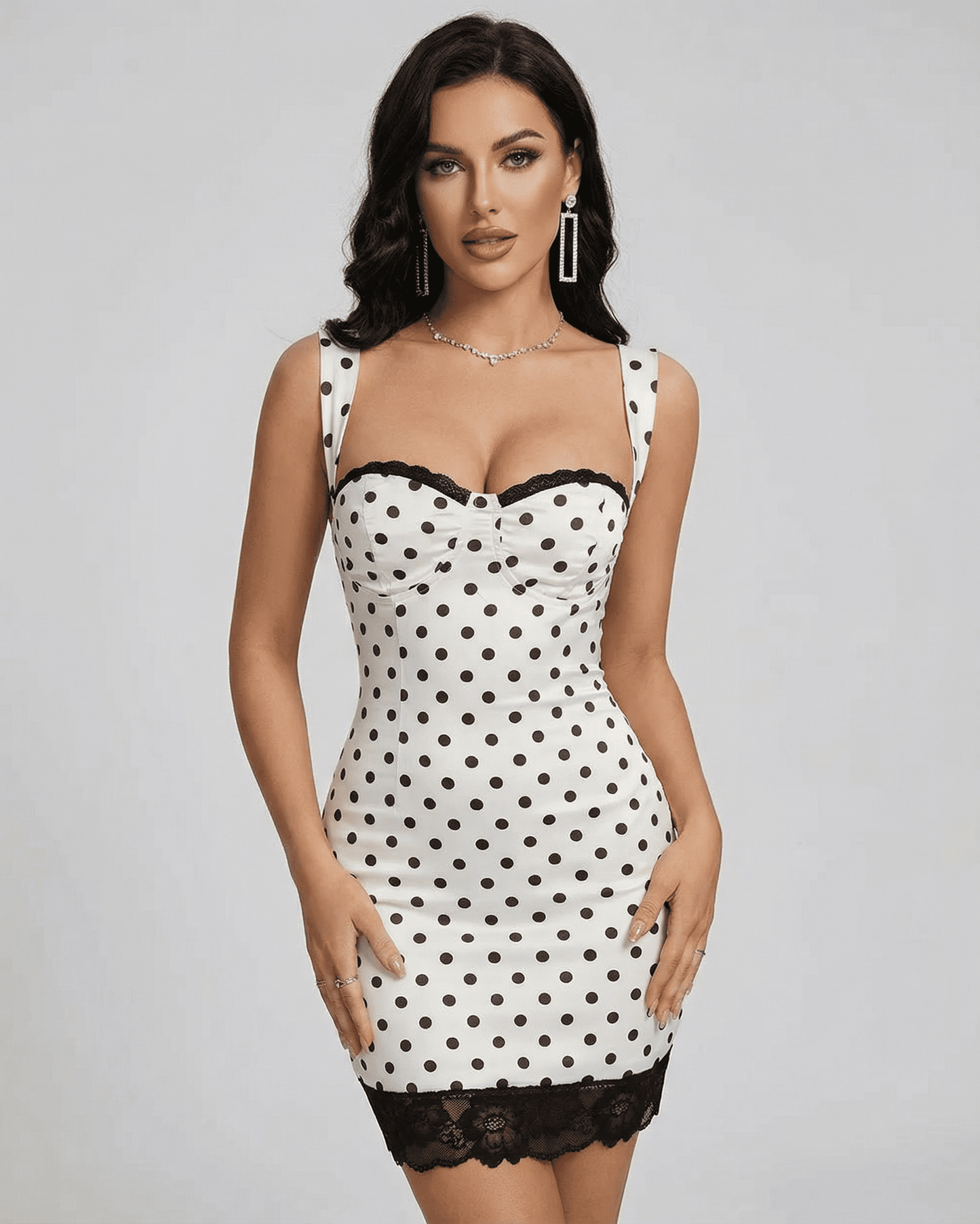 Celeste Mini Dress by Lauven - Polka dot mini dress with lace trim and high waist, perfect for a vintage-inspired look.