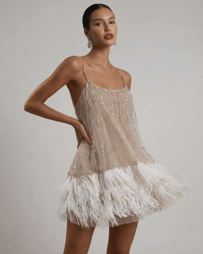 Celeste Mini Dress by Lauven, featuring a sequin tulle design and feather tassel hem for elegant fairycore style.