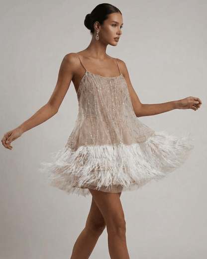 Celeste Mini Dress by Lauven, sequin tulle dress with feather tassel hem, elegant and airy design.