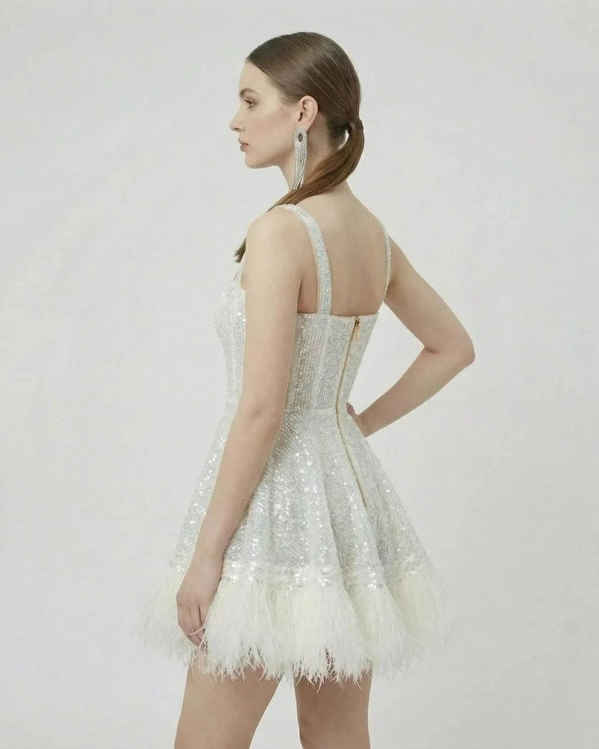 Celeste Mini Dress by Lauven, featuring silver sequins and faux fur hem in A-line silhouette.