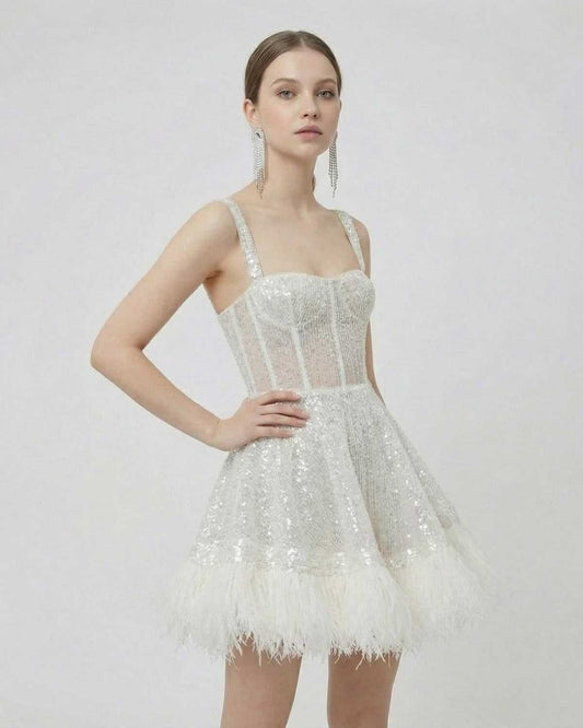 Celeste Mini Dress by Lauven featuring silver sequins and faux fur hem, highlighting an A-line silhouette.