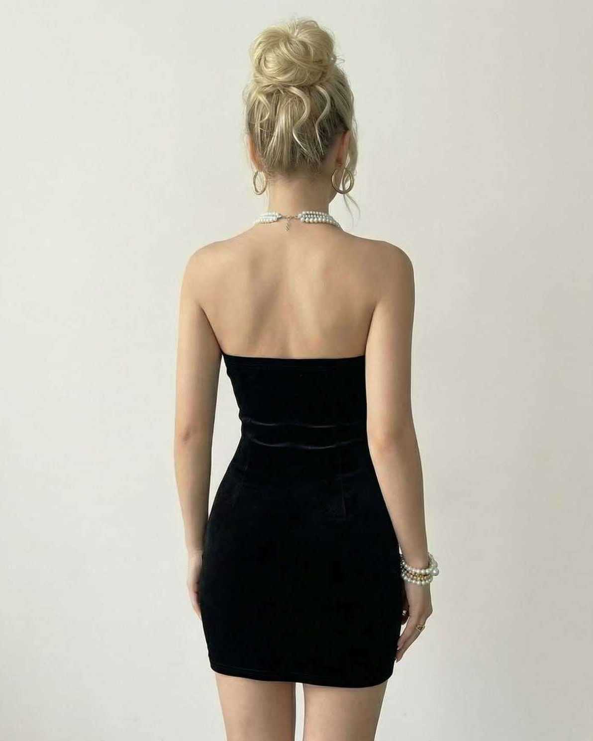 Celeste Mini Dress by Lauven, strapless black velvet design showcasing pearl accents on a flattering back view.