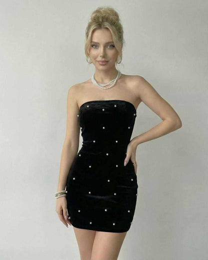 Lauven Celeste Mini Dress in black velvet with pearl accents, showcasing a strapless silhouette and form-fitting design.