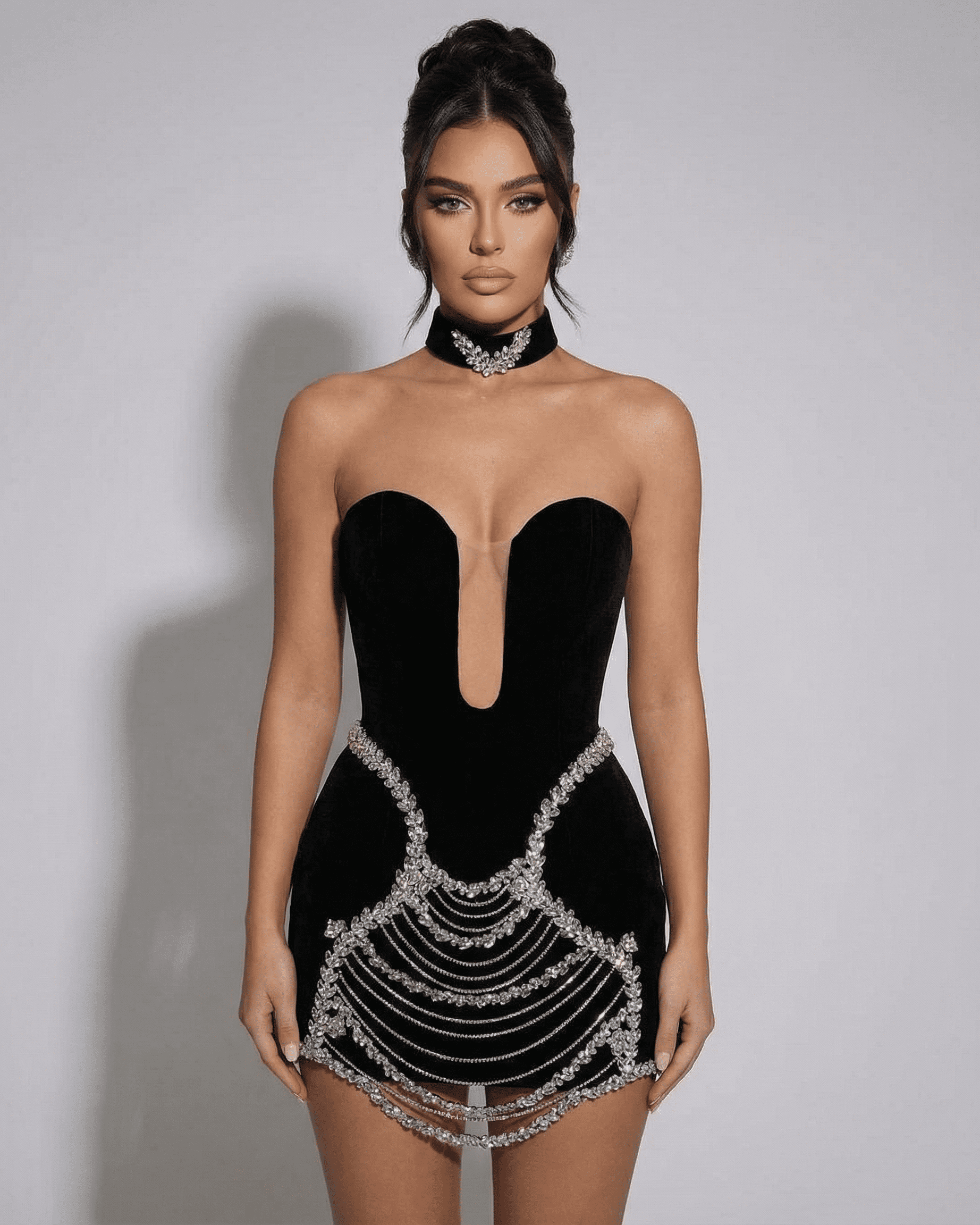 Celeste Mini Dress by Lauven featuring a velvet bodycon design with rhinestone chain detail.
