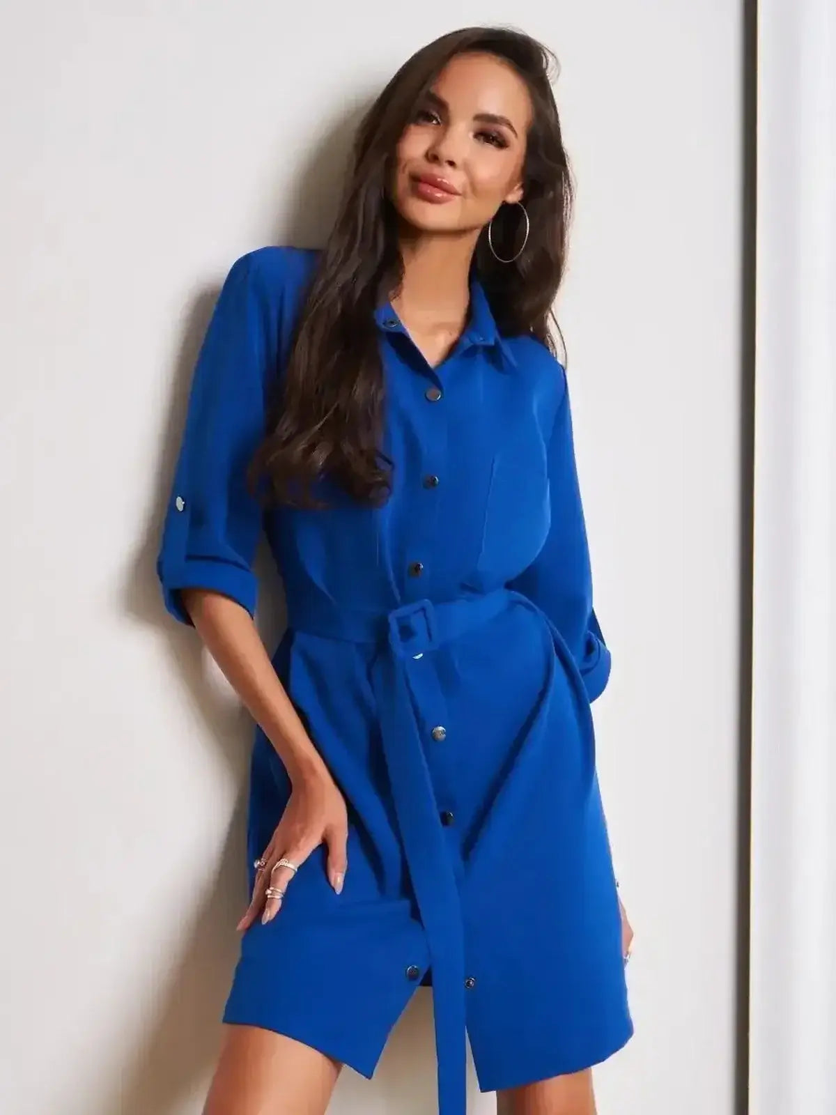 Cobalt Charm Mini Dress by Lauven featuring a structured silhouette and adjustable waist belt, styled in vibrant blue.