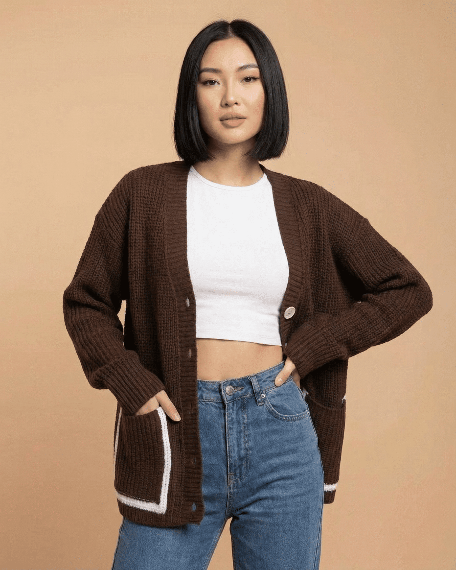 Model wearing a Cocoa Cardigan from Lauven, featuring a color block design and a relaxed fit.