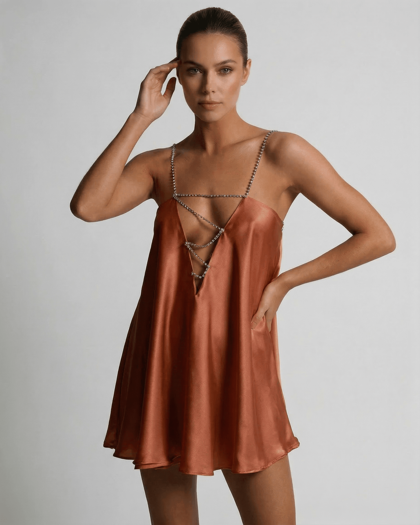 Copper Mini Dress by Lauven featuring luxurious satin with rhinestone detail and a flattering A-line silhouette.