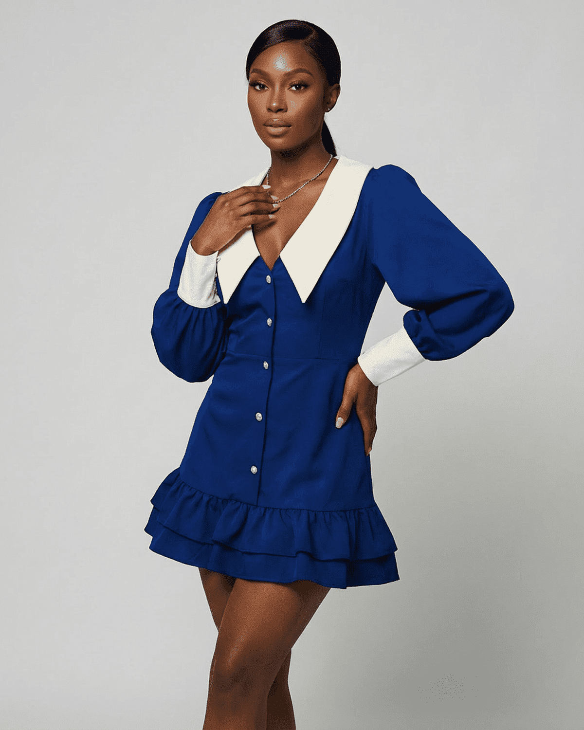 Corinne Mini Blue by Lauven featuring a color block design, white collar, and puff sleeves for a chic look.