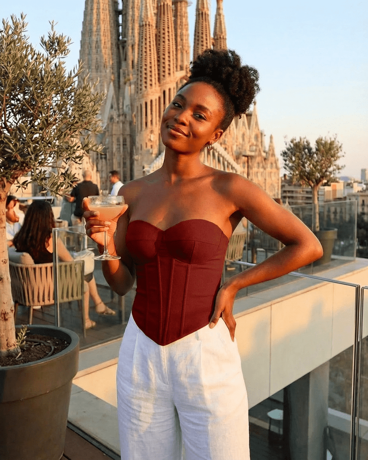 Model showcasing the Crimson Corset Top by Lauven, featuring faux denim bustier design and structured fit.