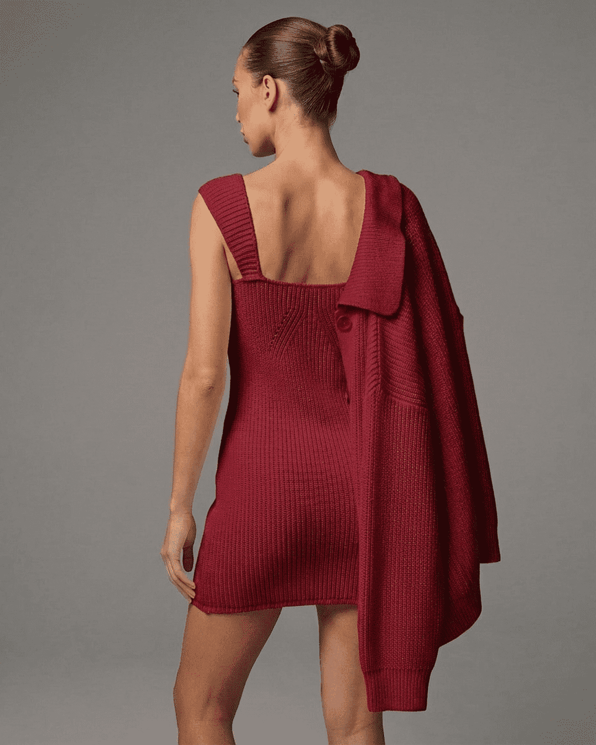 Crimson Mini Dress by Lauven, showcasing a sleek back view of the vibrant knit bodycon design in rich red.