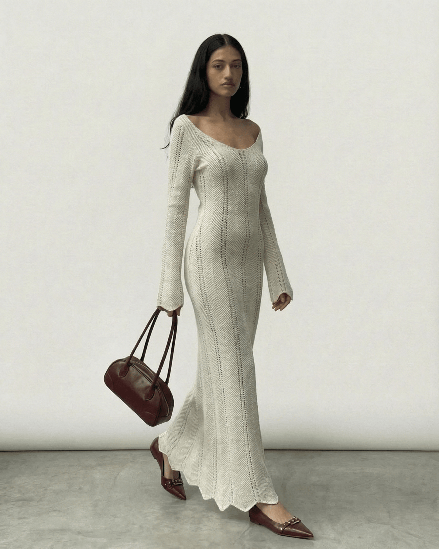 Model wearing Elara Maxi Dress by Lauven, featuring a ribbed design and flowing silhouette.