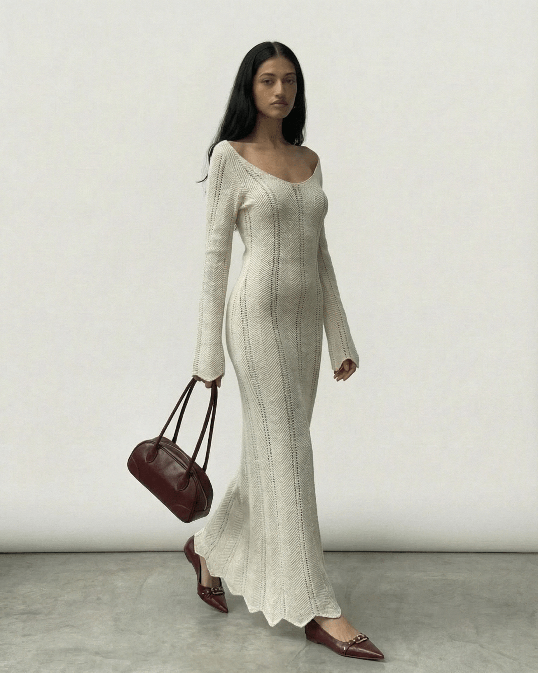 Model wearing Elara Maxi Dress by Lauven, featuring a ribbed design and flowing silhouette.