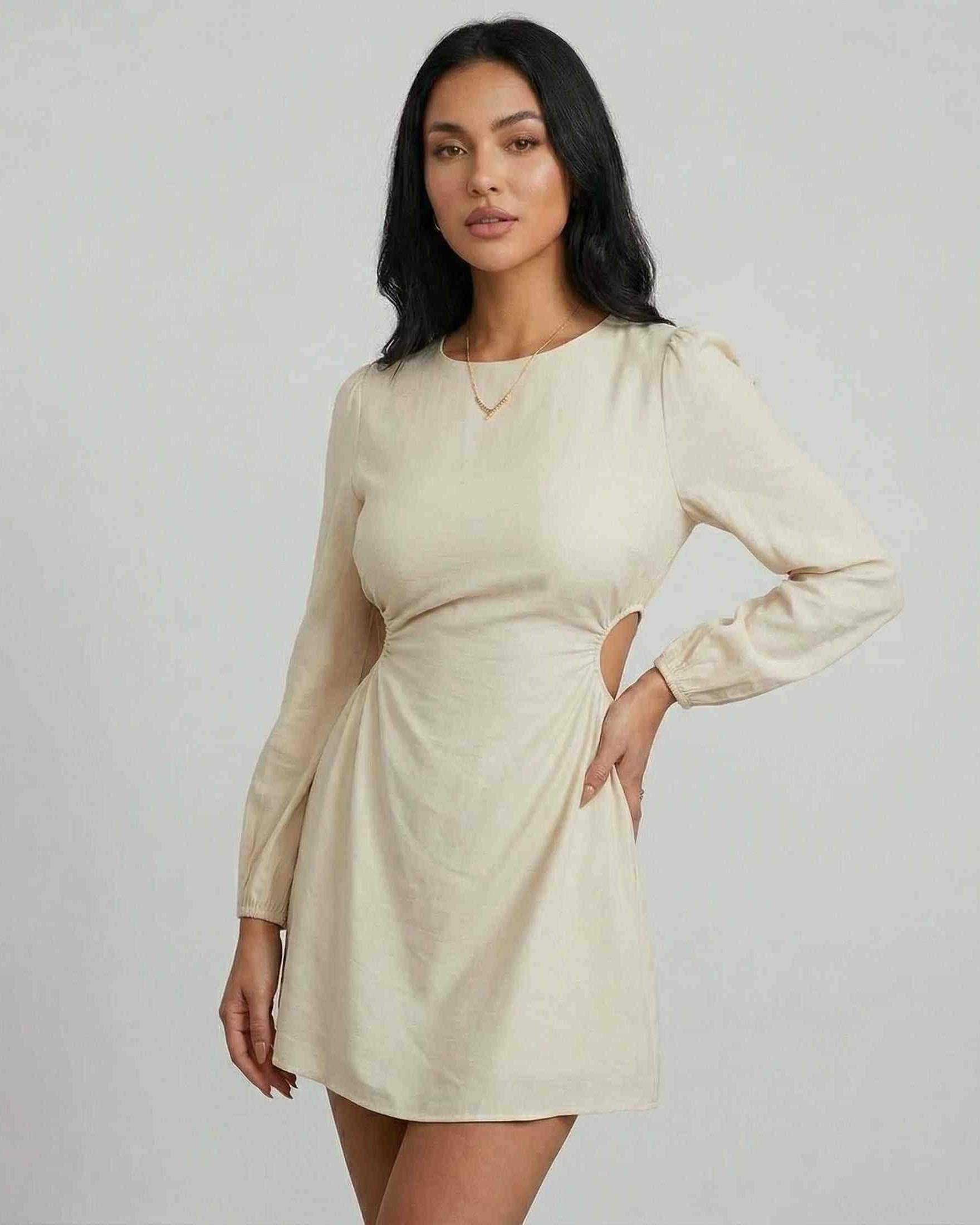 Elara Mini Dress by Lauven, featuring long sleeves, A-line silhouette, and stylish cut-out detail in a light color.
