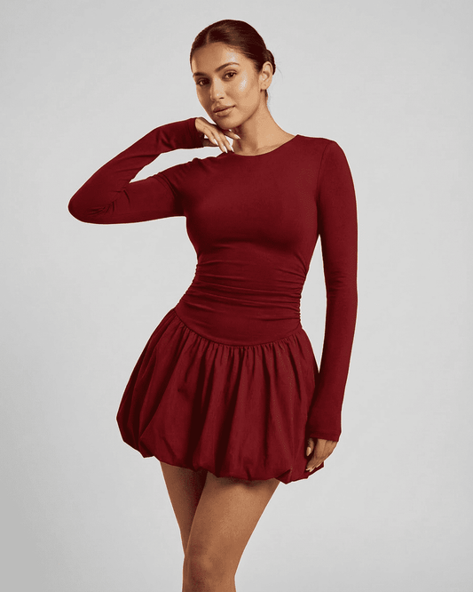 Elara Mini Red by Lauven – Stylish long sleeve fitted mini dress in a rich red shade with a tiered skirt.