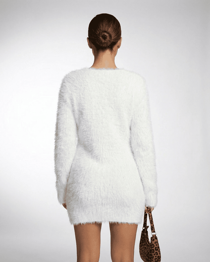 Back view of a model wearing the Elara Sweater by Lauven, showcasing its soft, fuzzy texture and elegant design.