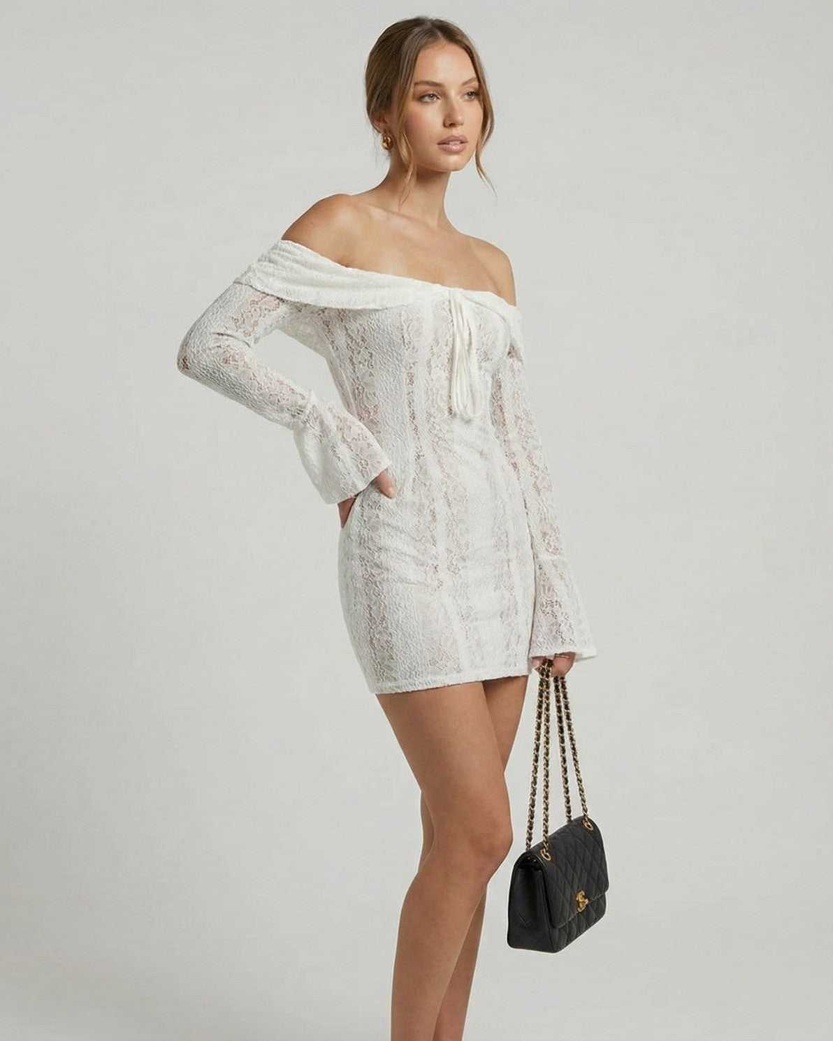 Luna Mini Dress by Lauven, elegant off-shoulder lace dress in white with long flared sleeves.