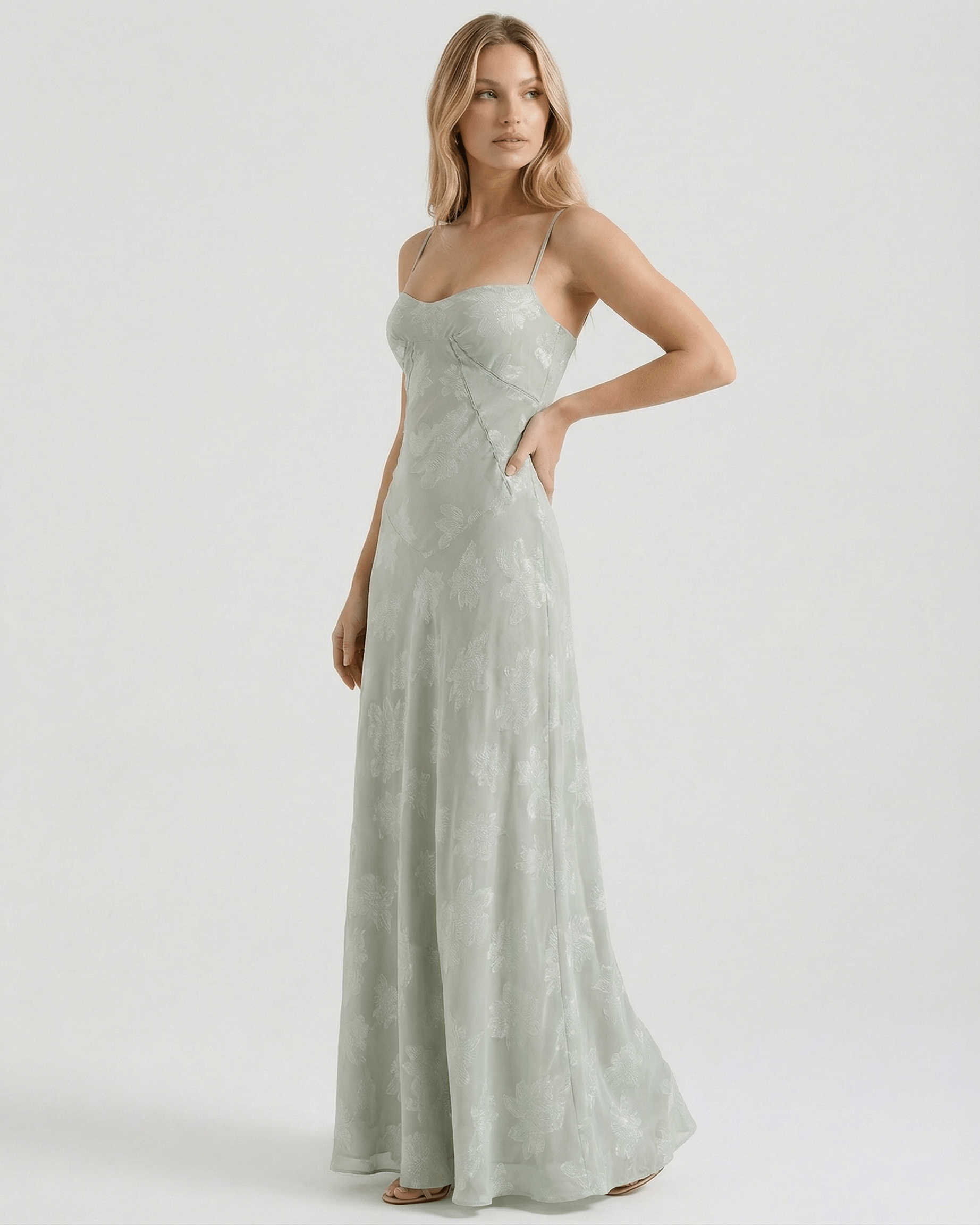 Eliara Maxi Dress by Lauven in sage-green floral print with sheer lace-up back and slim spaghetti straps.