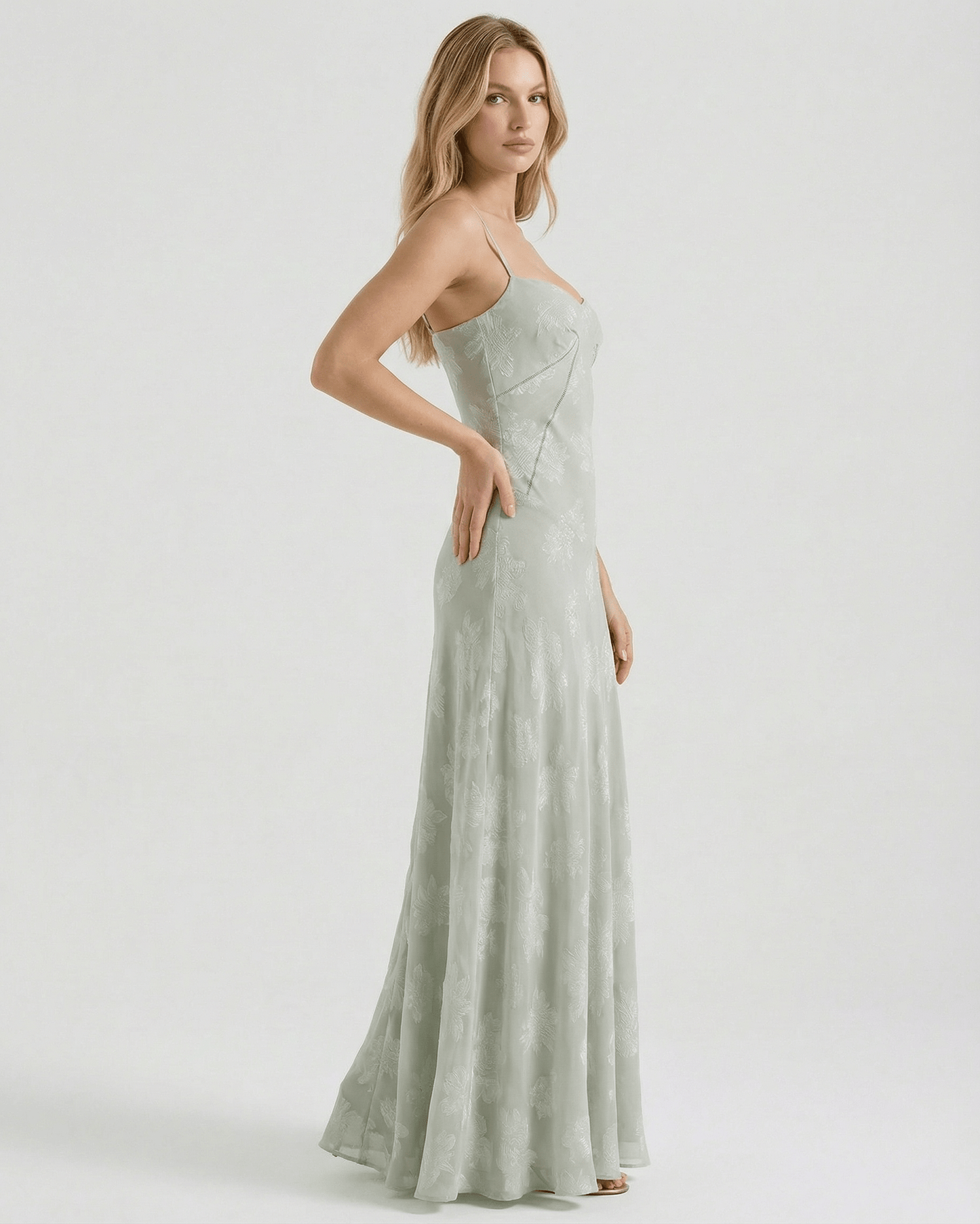 Eliara Maxi Dress by Lauven, showcasing a sage-green floral print and elegant sheer design, perfect for formal occasions.