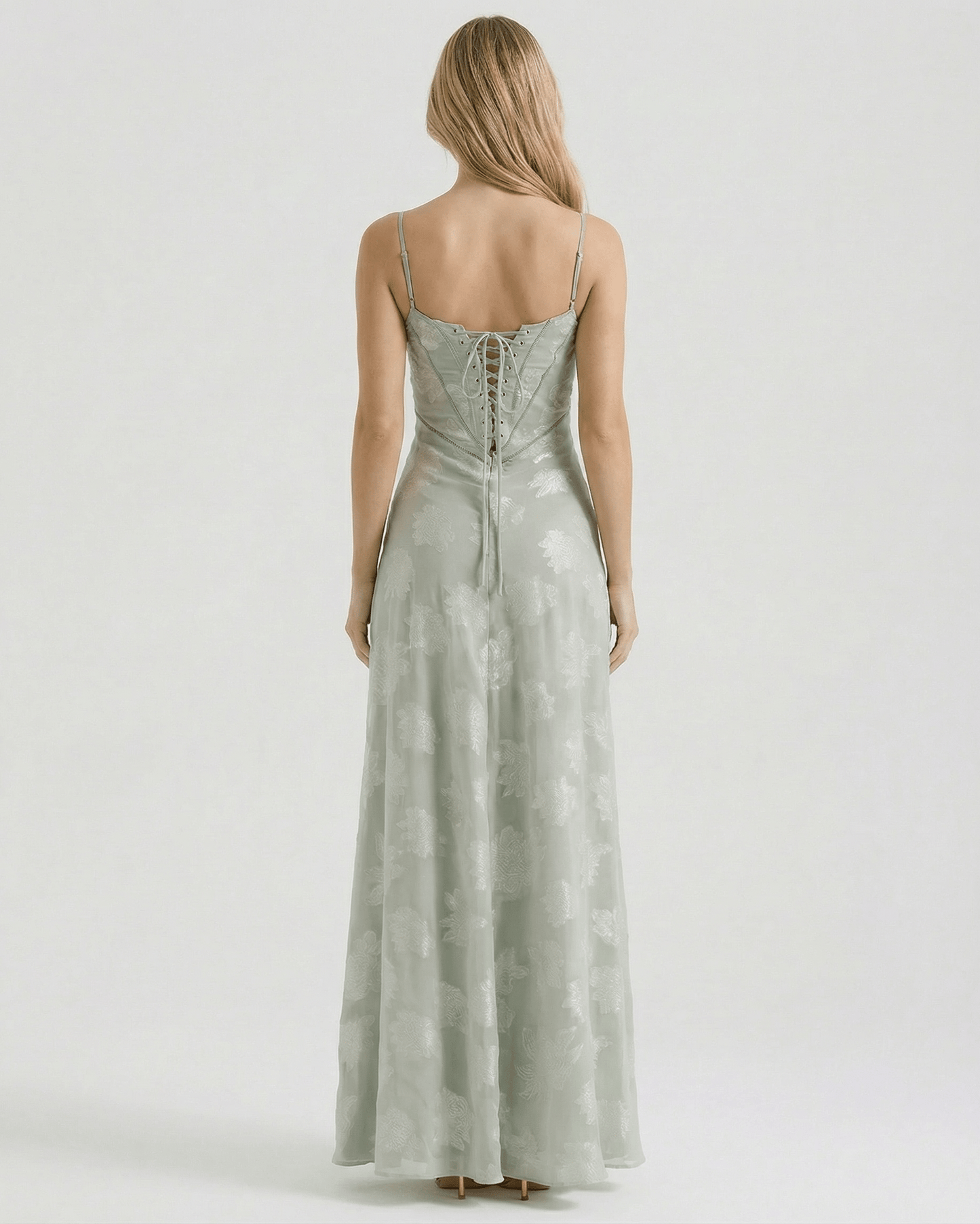 Back view of Eliara Maxi Dress by Lauven, featuring sheer floral print and lace-up detailing.