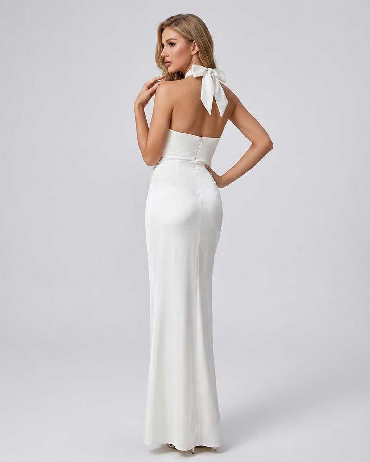Elysia Maxi Dress by Lauven, showcasing a halter neck and sleek back design in solid white.