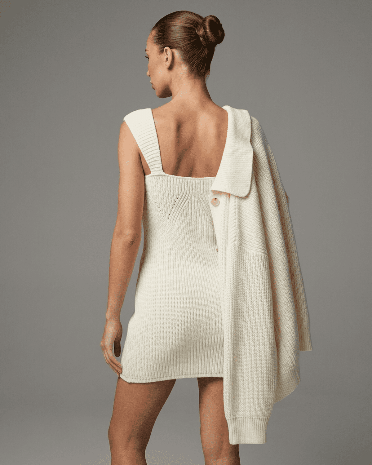 Elysia Mini Dress by Lauven, showcasing a chic fitted knit design with a modern high-waist profile.