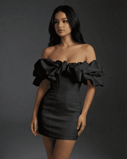 Elysia Mini Dress by Lauven featuring a dramatic off-the-shoulder silhouette and ruffle trim in classic black.