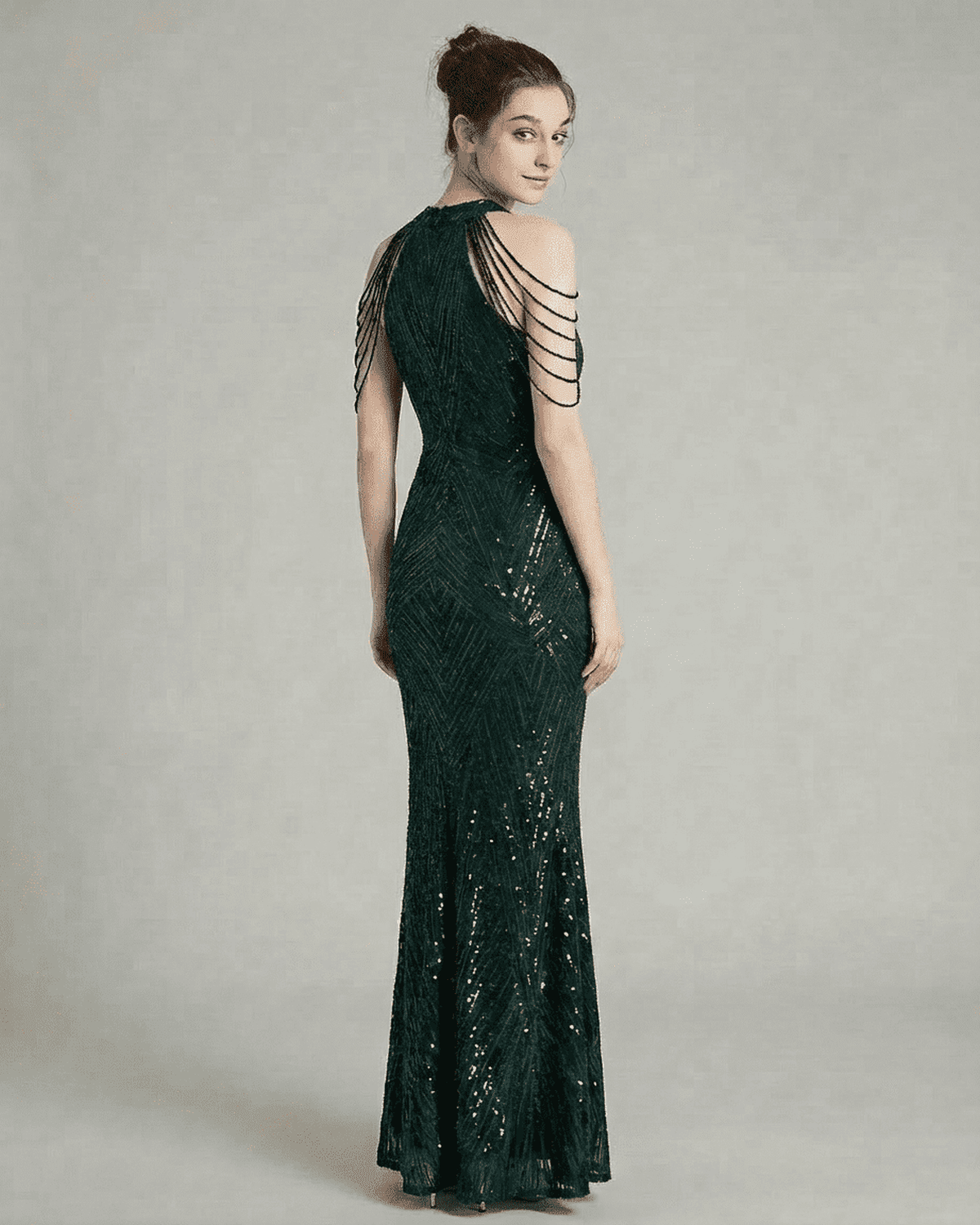 Emerald Maxi Dress by Lauven features a striking back design with beaded shoulder drapes, embodying elegance and sophistication.