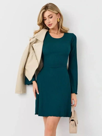 Emerald Whisper mini dress by Lauven in emerald green, perfect for day-to-night styling and flattering silhouette.