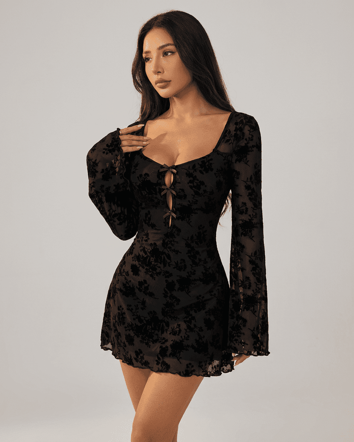 Fleur Mini Dress by Lauven featuring floral flocking, long sleeves, and a flattering bodycon silhouette.