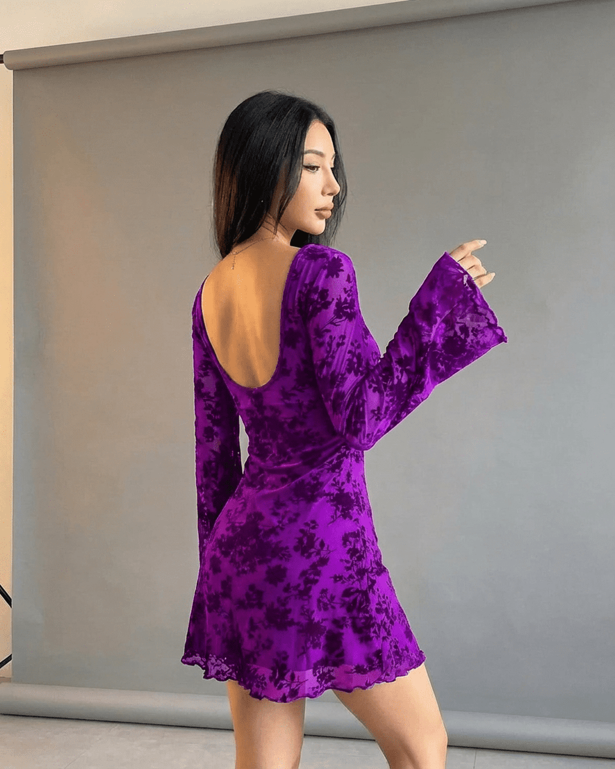 Fleur Mini Violet by Lauven – Stunning purple floral bodycon dress with long flared sleeves and elegant cutouts.