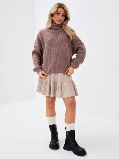Florence Sweater by Lauven, oversized knit with turtleneck, styled with a skirt and boots.