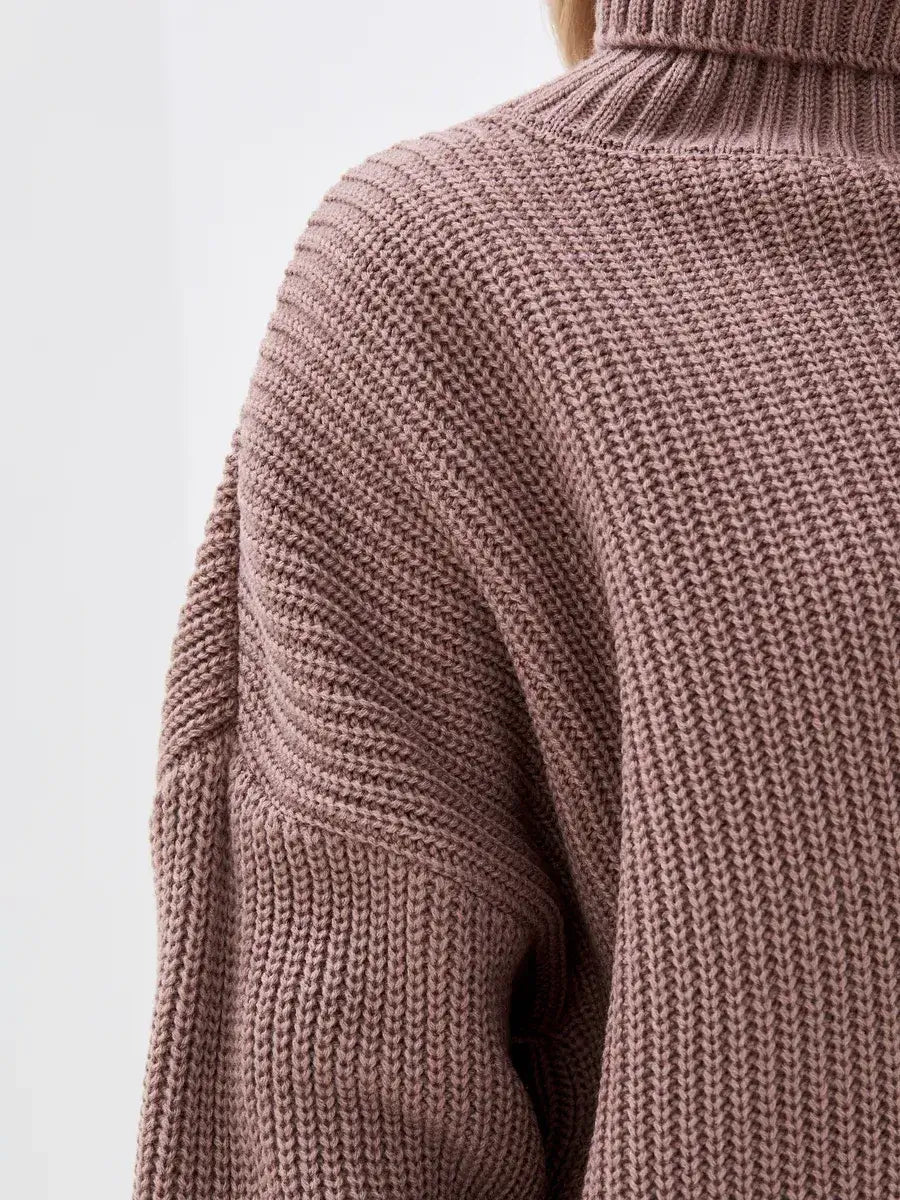 Close-up of the Florence Sweater by Lauven, showcasing the oversized knit and turtleneck in a warm coffee hue.