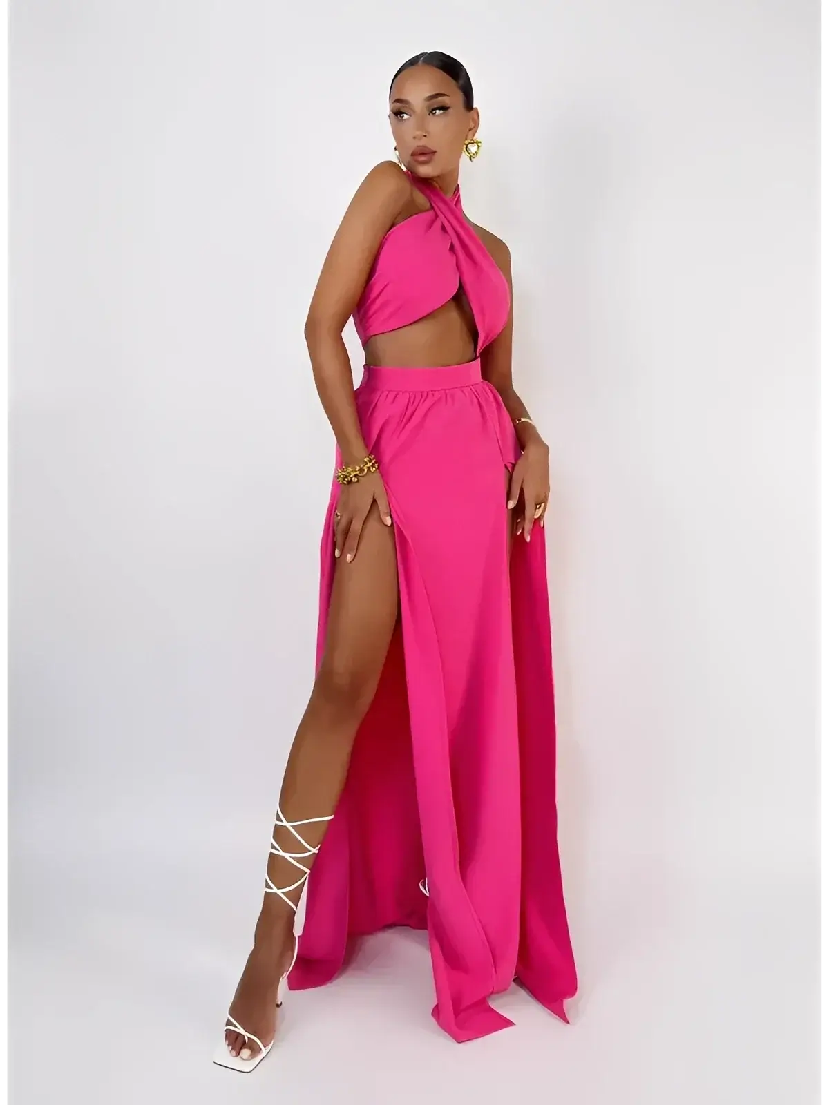 Fuchsia Breeze Set by Lauven featuring criss-cross top and flowing skirt, ideal for beach strolls and soirées.