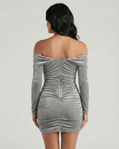 Back view of the Milano Mini Dress by Lauven, gray velvet off shoulder mini dress with long sleeves.
