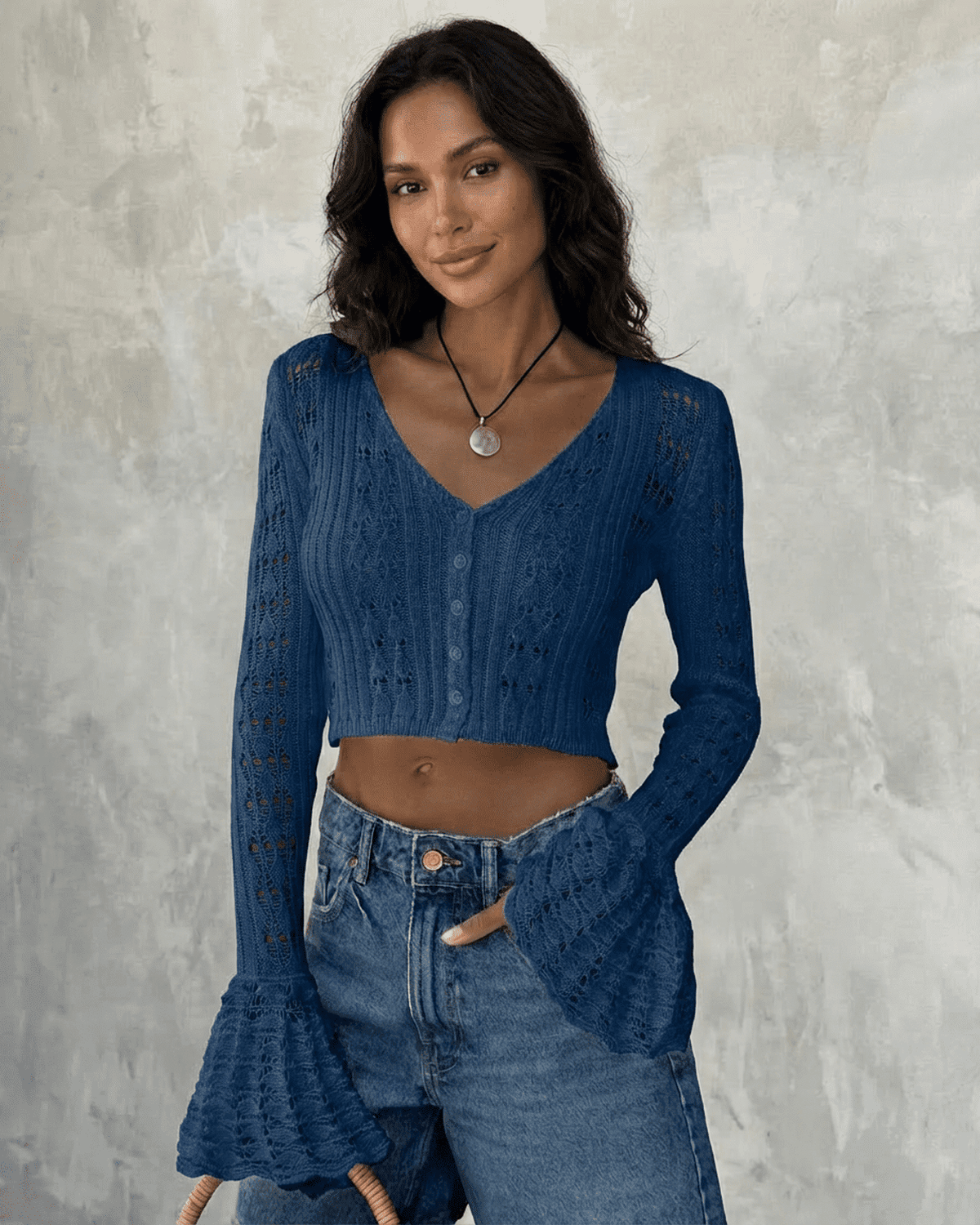 Indigo Cardigan from Lauven featuring a cropped design with flare sleeves and hollow-out detailing, perfect for elegant styling.