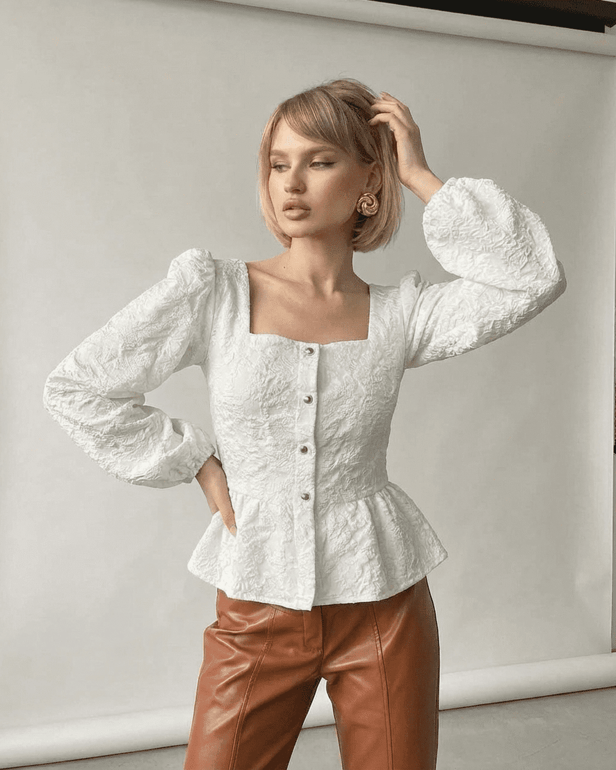 Ivory Corset Top by Lauven, featuring a jacquard fabric, square neckline, and puff sleeves for a sophisticated look.