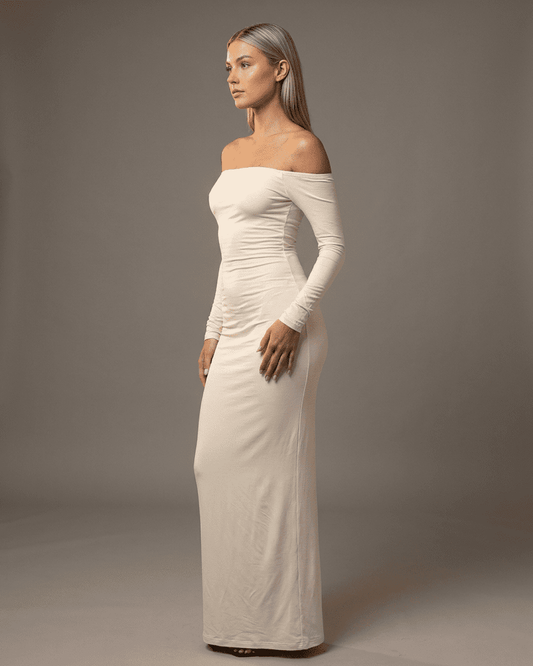Ivory Maxi Dress by Lauven, featuring an off-shoulder design and long sleeves, showcasing an elegant silhouette.