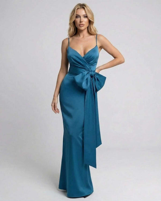 Laguna Maxi Dress by Lauven, asymmetrical sleeveless design with a statement bow in a refined solid teal finish.
