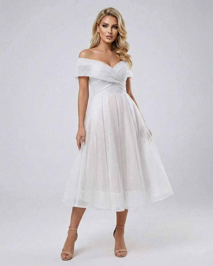 Liora Midi Dress by Lauven, elegant off shoulder white dress with flowing skirt and soft chiffon fabric.