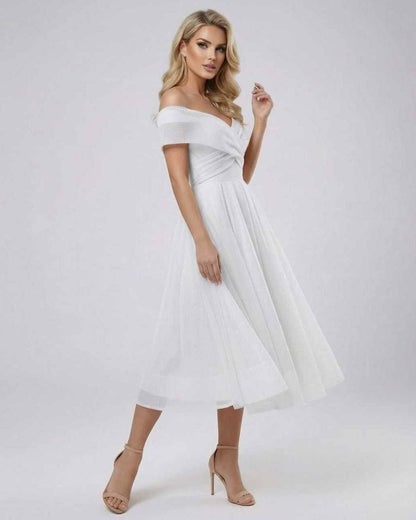 Liora Midi Dress by Lauven - Elegant off shoulder white dress with a flowing skirt.