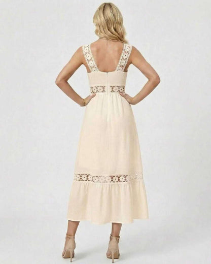 Back view of woman wearing Liora Midi Dress by Lauven showcasing lace insets and A-line silhouette.