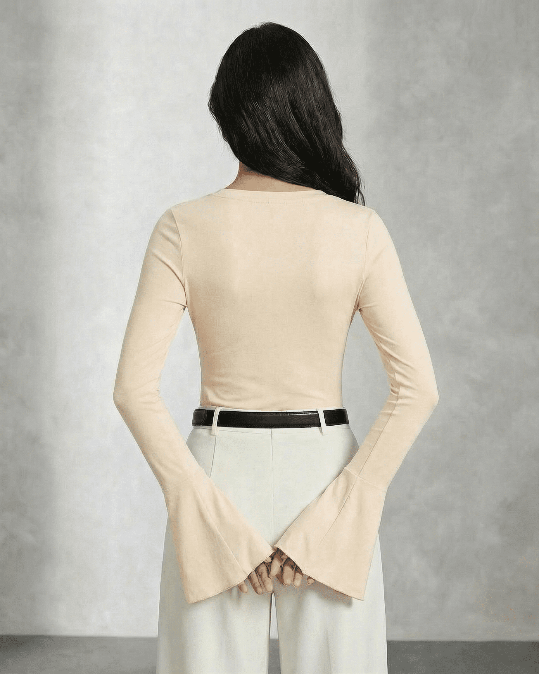Back view of the elegant Luna Blouse by Lauven, featuring flare sleeves in a sophisticated beige hue.