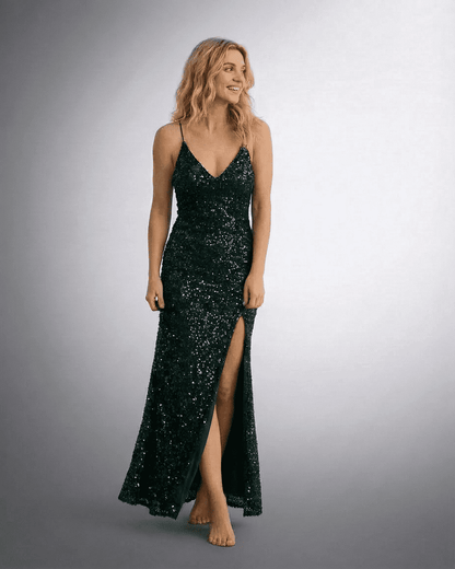 Lauven Luna Maxi Dress featuring a sleeveless design, deep green sequin fabric, V-neckline, and thigh-high slit for a glamorous look.