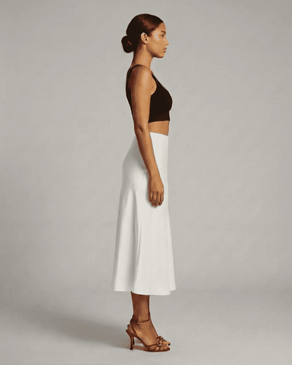 Luna Midi Skirt by Lauven, elegant satin mermaid midi skirt in white, showcasing a refined silhouette and soft flow.