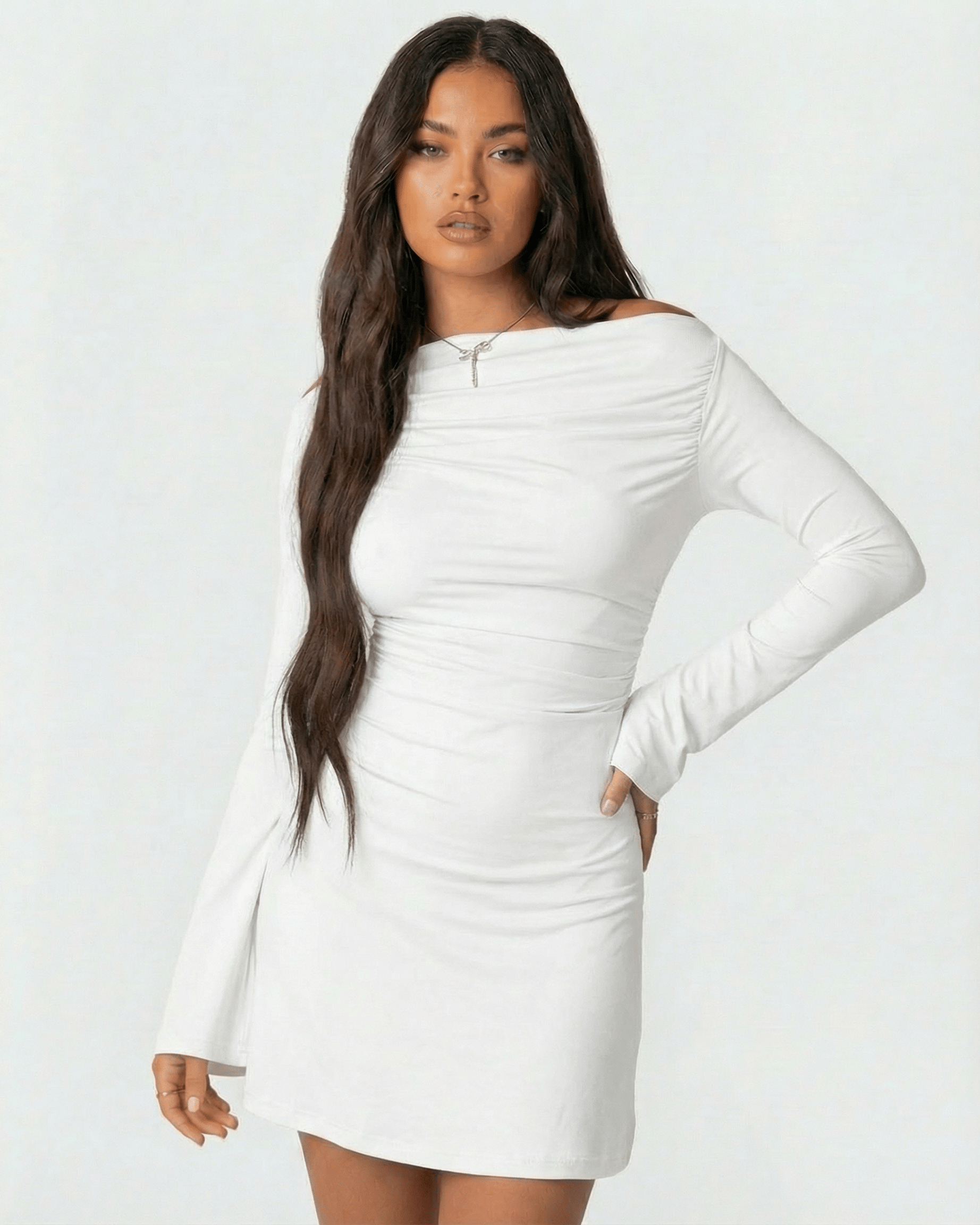 Luna Mini Dress by Lauven featuring asymmetrical neckline and long sleeves in classic white.