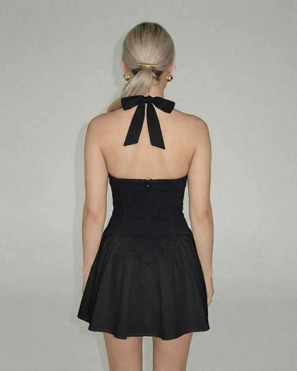 Lauven Luna Mini Dress in Elegant Black, halter neck with tied back and flared skirt, showcasing back view.