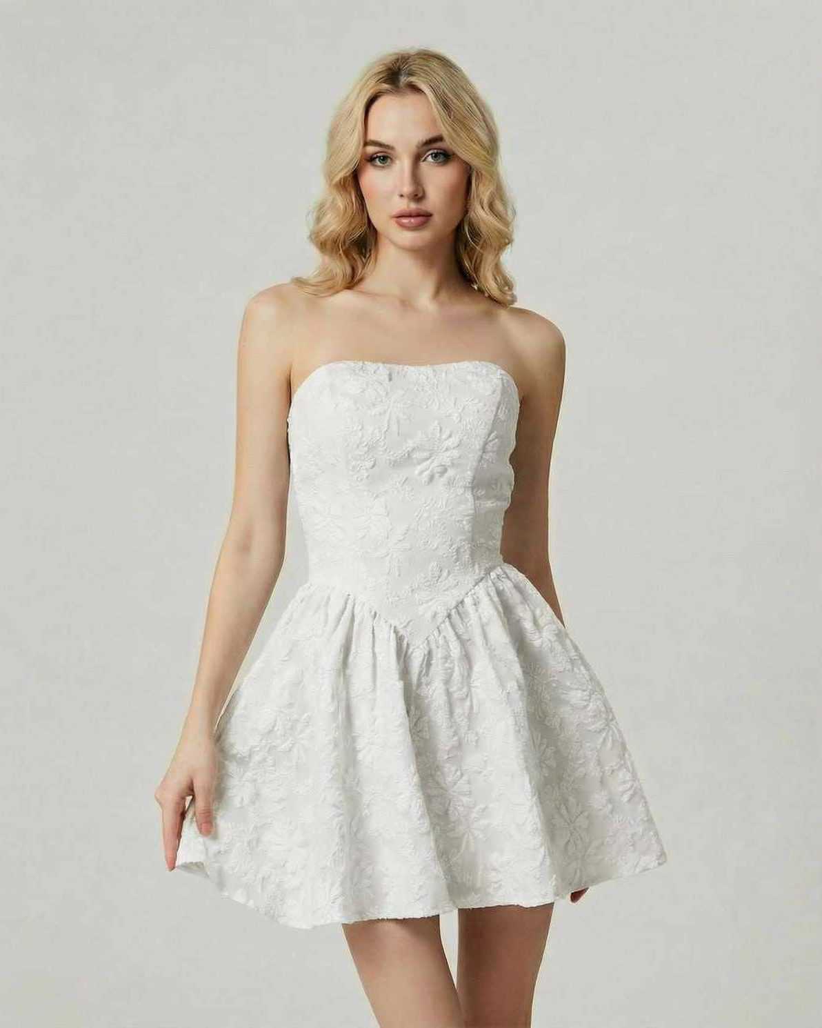 Luna Mini Dress by Lauven in classic white floral jacquard, featuring a strapless design and flared skirt silhouette.