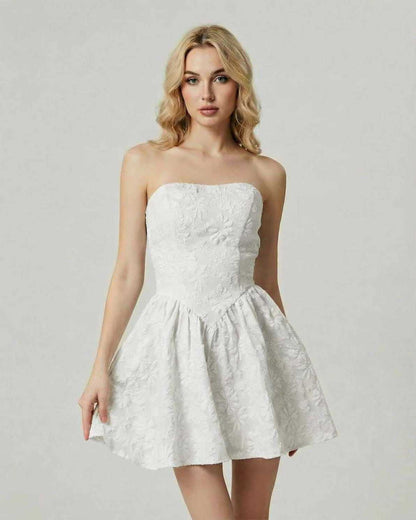 Luna Mini Dress by Lauven in classic white floral jacquard, featuring a strapless design and flared skirt silhouette.